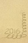 Inscription 2016 And Streamers In The Sand On The Beach Stock Photo