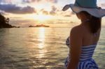 Girl On The Beach At Sunrise Stock Photo