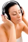 Top View Of Female Enjoying Music With White Background Stock Photo