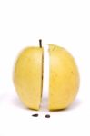 Yellow Apple Sliced In Half On White Stock Photo