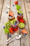 Red And Green Jelly Served With Fruit Stock Photo