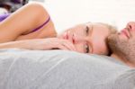 Couple Lying In Bed Stock Photo