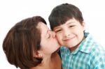 Mother Kissing Her Son Stock Photo