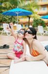 Mother And Daughter In Pool Stock Photo