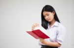 Asia Thai High School Student Uniform Beautiful Girl Read A Book Stock Photo