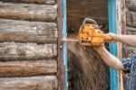 Man Sawing A Window Stock Photo