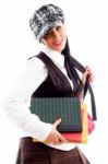 Young Student Wearing Cap Holding Her Study Material Stock Photo