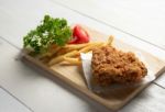 Fried Chicken With Fries On A Plate Stock Photo