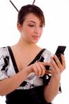 Front View Of Smiling Woman Using Cell Phone Stock Photo