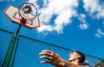 Young Man Playing Basketball Stock Photo