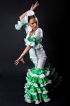 Young Flamenco Dancer In Beautiful Dress On Black Background Stock Photo