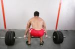 Man Makes Exercises For Increase In Force Of Muscles.  Focus In Stock Photo