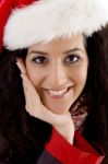 Smiling Woman Wearing Christmas Hat Stock Photo