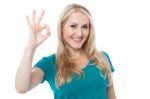 Smiling Woman Gesturing Perfect Sign Stock Photo