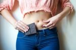 Young Woman With Chocolate Showing Her Fat Stock Photo