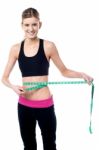 Young Slim Girl Measuring Her Waist Stock Photo