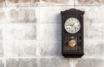 Antique Wall Clock With A Pendulum Stock Photo