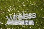 Wireless Text And Keyboard On Grass Stock Photo