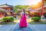 Woman With Hanbok In Gyeongbokgung,the Traditional Korean Dress Stock Photo