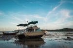 Motor Boat With Low Tide Stock Photo