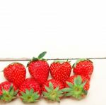 Fresh Organic Strawberry Over White Wood Stock Photo