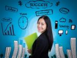 Young Business Woman Has Many Ideas On Business Background Stock Photo