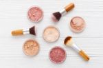 Makeup Powder With Brushes On Wood Background Stock Photo