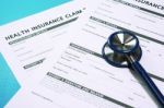 Health Insurance Claim Form With Stethoscope Stock Photo