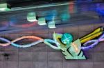 Man Shaped Neon Light In An Underground Car Park Stock Photo