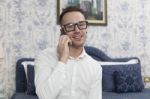 Business Man In A Hotel Room And Phones Stock Photo