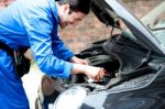 Smiling Male Mechanic At Work Stock Photo