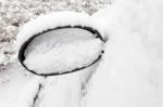 Car Mirror Filled With Snow Stock Photo