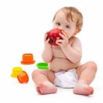 Cute Infant Boy With Apple Stock Photo