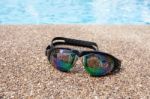 Glasses For Swimming On A Cement Floor With Small Stone Near Swi Stock Photo