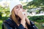 Portrait Of Beautiful Girl With Tissue Having Flu Or Allergy Stock Photo