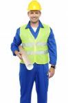 Young Worker Holding Blueprint Stock Photo