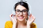 Beautiful Brunette Woman Listening To Music Stock Photo