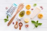 The Ingredients For Homemade Pesto Pasta On White Wooden Backgro Stock Photo