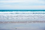 Sand Beach With Blue Ocean Stock Photo