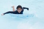 Boy Play In Clear Water Stock Photo