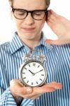 Boy Irritated With Noise Alarm Stock Photo