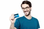 Young Man Holding Credit Card Stock Photo