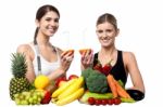 Smiling Girls Holding Juicy Slice Of An Orange Stock Photo