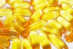 Shiny Yellow Fish Oil Capsule Pills Close Up Stock Photo