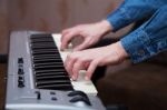 Hands Of The Musician On The Keyboard Synthesizer Closeup Stock Photo