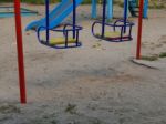 Children Playground, Swing Near The House  Stock Photo