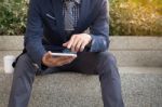 Asian Indian Businessman Using Tablet Pc Outdoors, Golden Sunlig Stock Photo