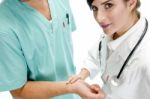 Nurse Checking Pulse Of Patient Stock Photo