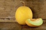 Yellow Cantaloupe Melon On The Wooden Background Stock Photo