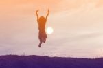 Silhouette Of Woman Praying Over Beautiful Sky Background Stock Photo